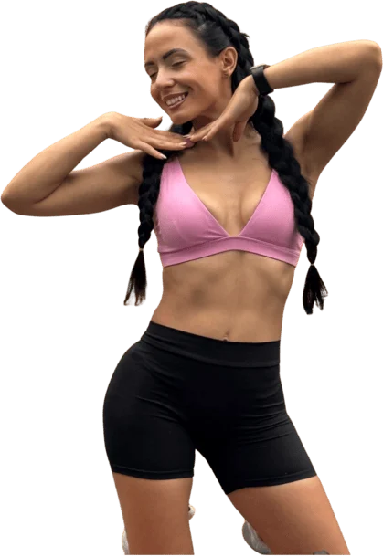 Elzhana smiling while demonstrating a standing home workout